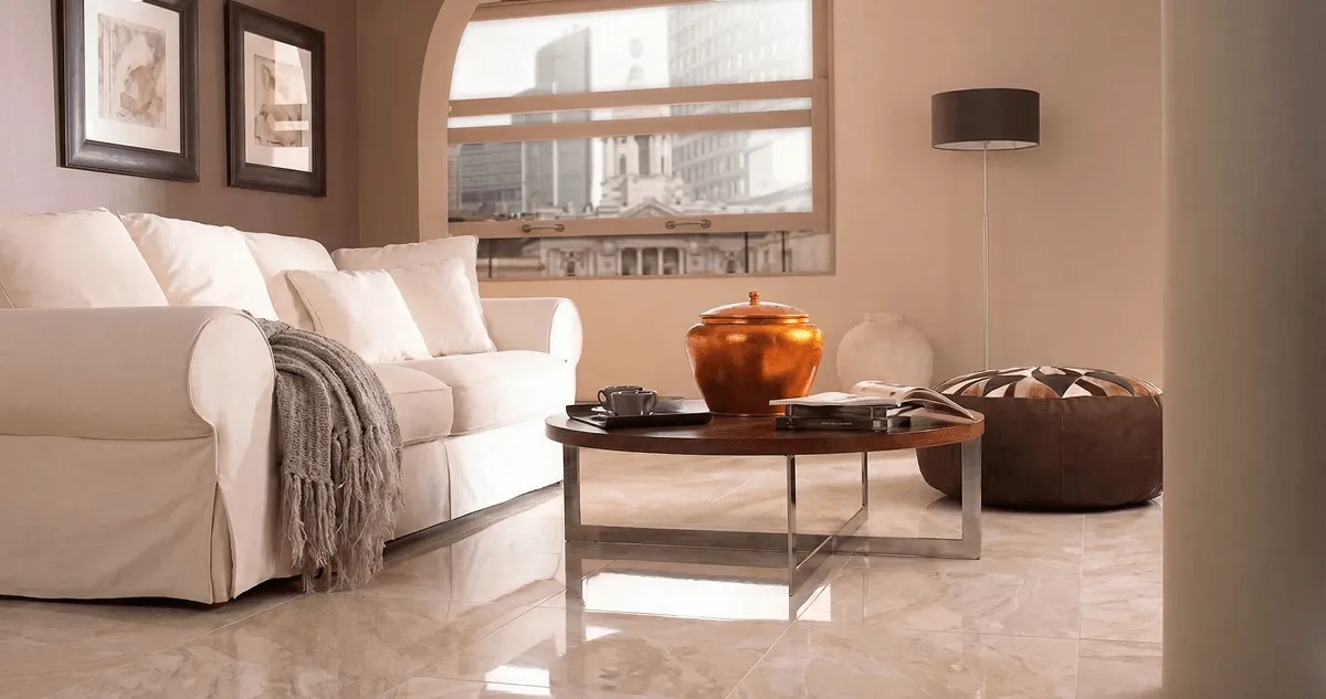 Modern living room with professionally installed marble flooring, a beige sofa, coffee table in Saint Petersburg, FL
